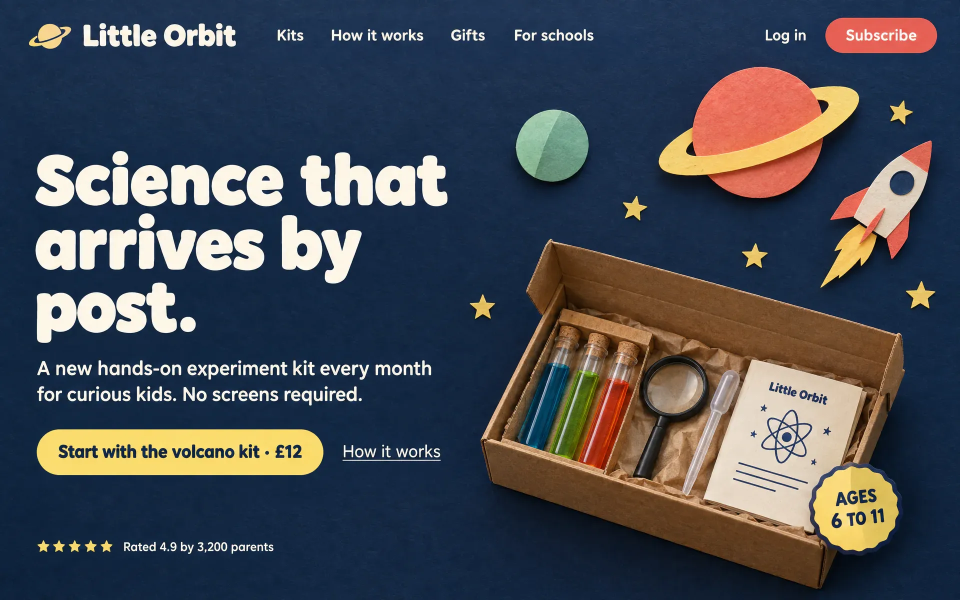A children’s science kit site built as a photographed cut-paper night sky: a coral planet, a paper rocket, and an open cardboard kit of test tubes